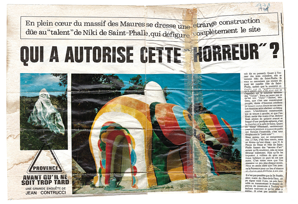 newspaper article in French asks "Who authorized this horror?" Two images in color of the sculptural houses are printed.